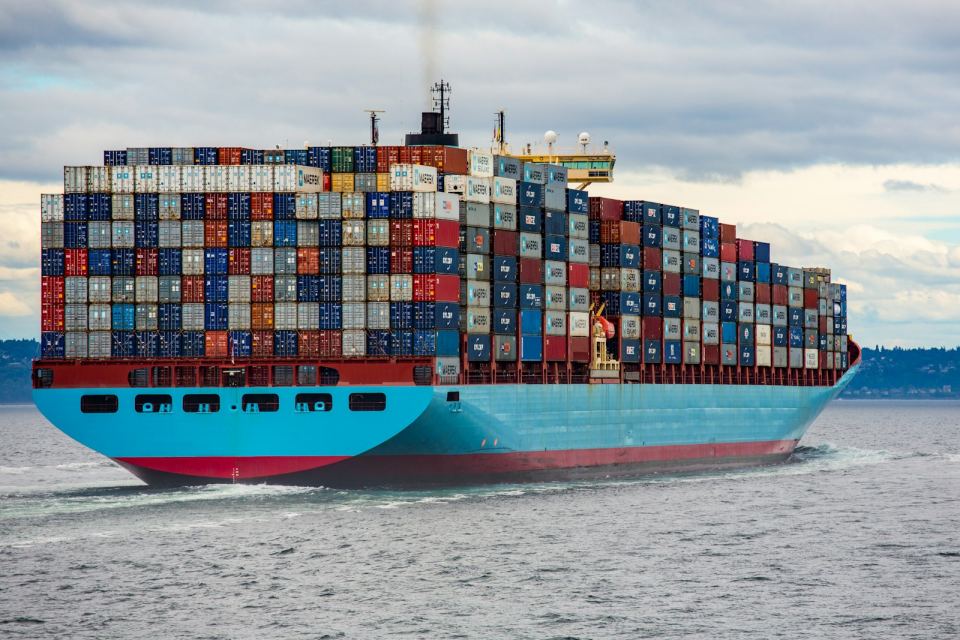 A fully loaded container vessel under way at sea