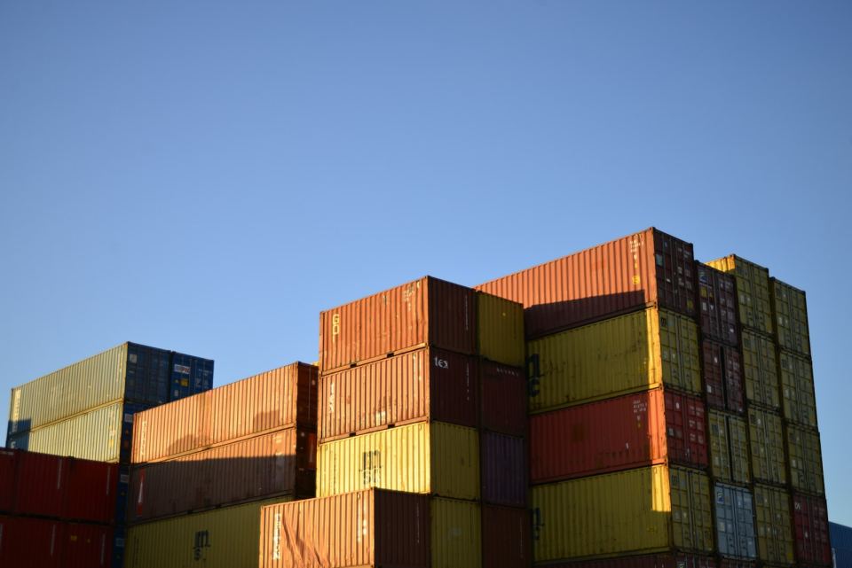 A block of containers stacked against an open sky